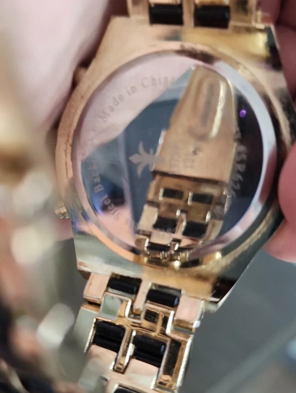 Gold Tone Bracelet Watch with Black Links